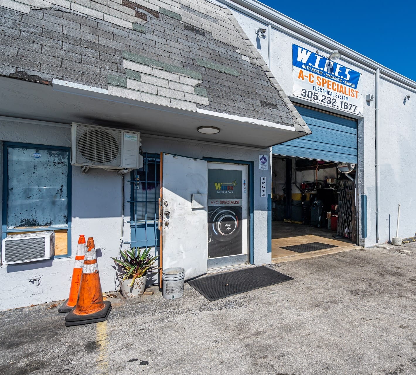 Wires Auto Repair storefront with the blue W.I.R.E.S sign over the open bay door